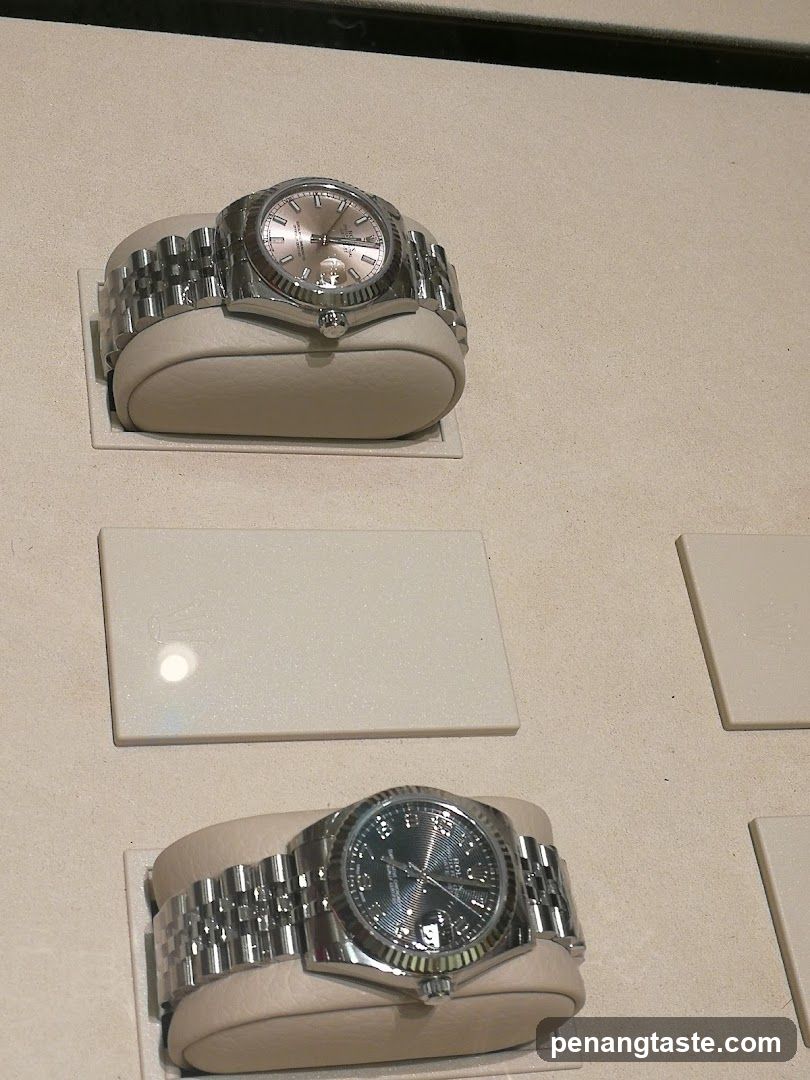 Two Rolex watches on display