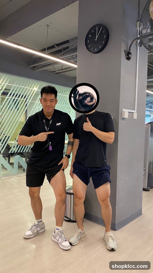 Two men in gym attire posing indoors
