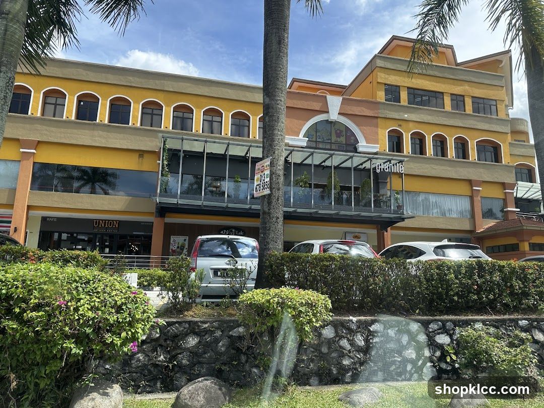 Shopping Center Exterior with Storefronts and Parking Area