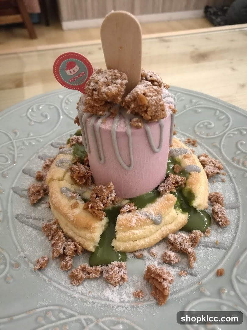 Dessert with Pink Mousse and Crumble Topping