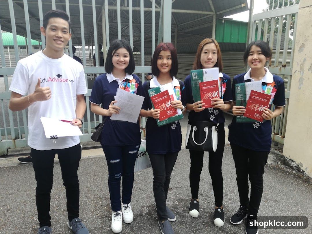 Group of students holding educational materials