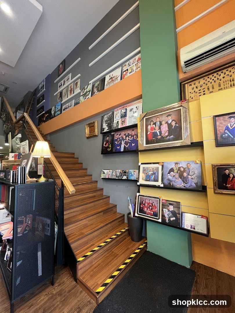 Interior of a shop with staircase and framed photos