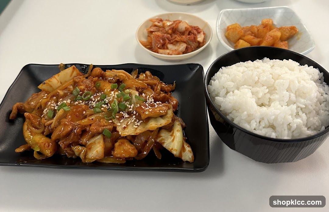 Korean-style stir-fry with rice and side dishes