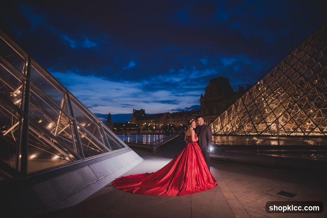 Couple in Red Dress at Louvre Pyramid Night