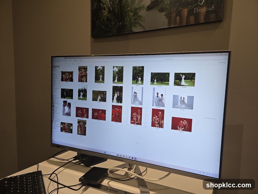 Computer Screen Displaying Wedding Photos