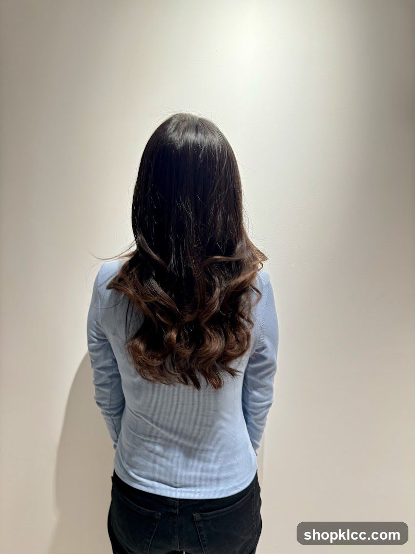 Back view of a person with long wavy hair