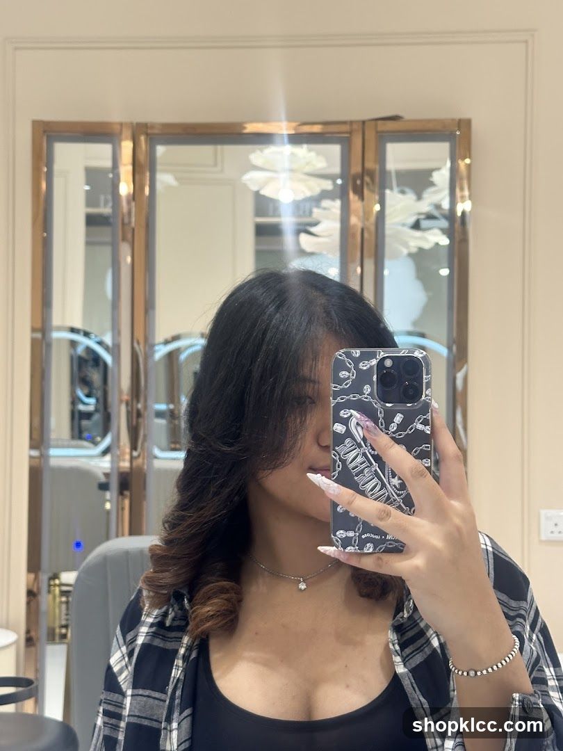 Mirror selfie in a salon or beauty shop interior