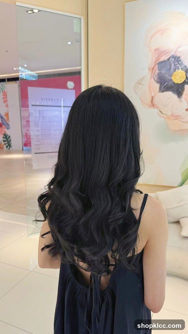 Woman with long wavy hair in a salon interior