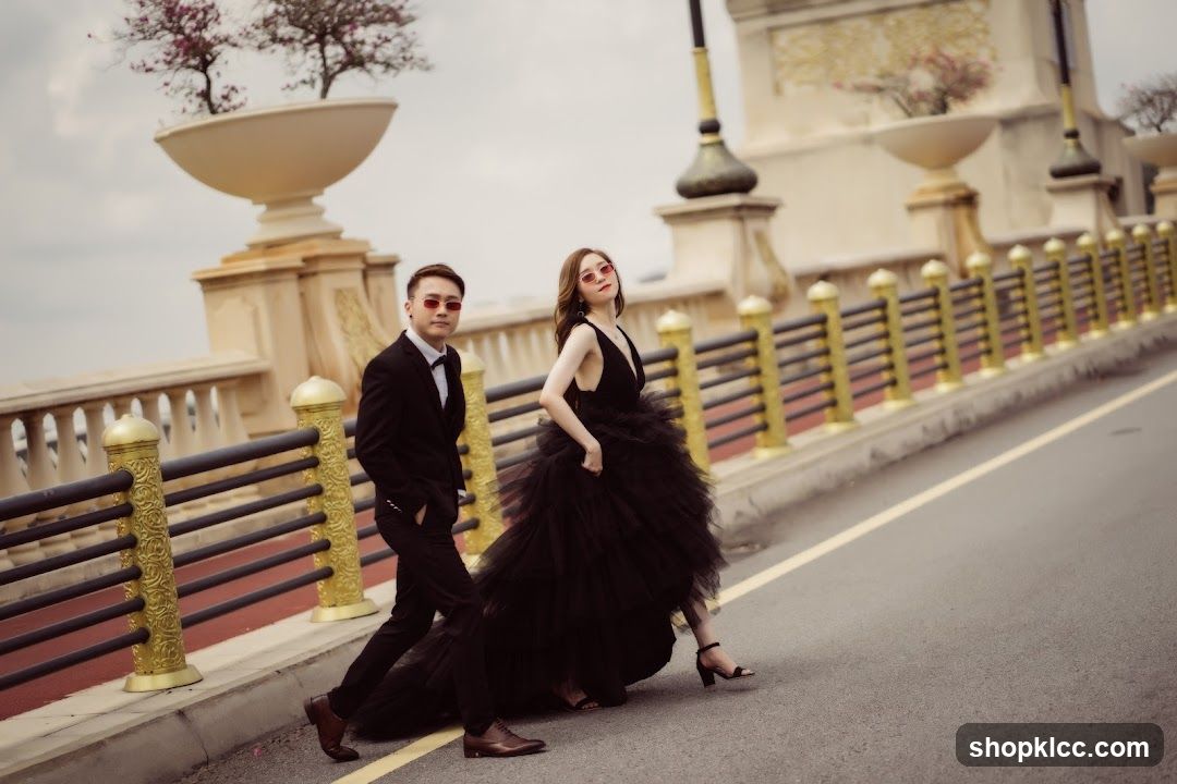 Couple in formal wear on a bridge