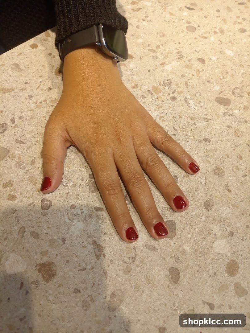 Hand with red nail polish
