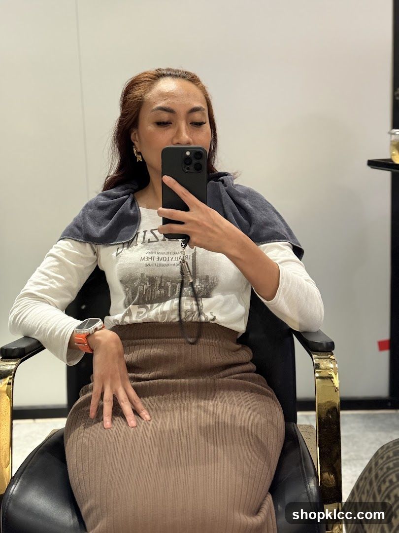 Woman taking a selfie in a salon