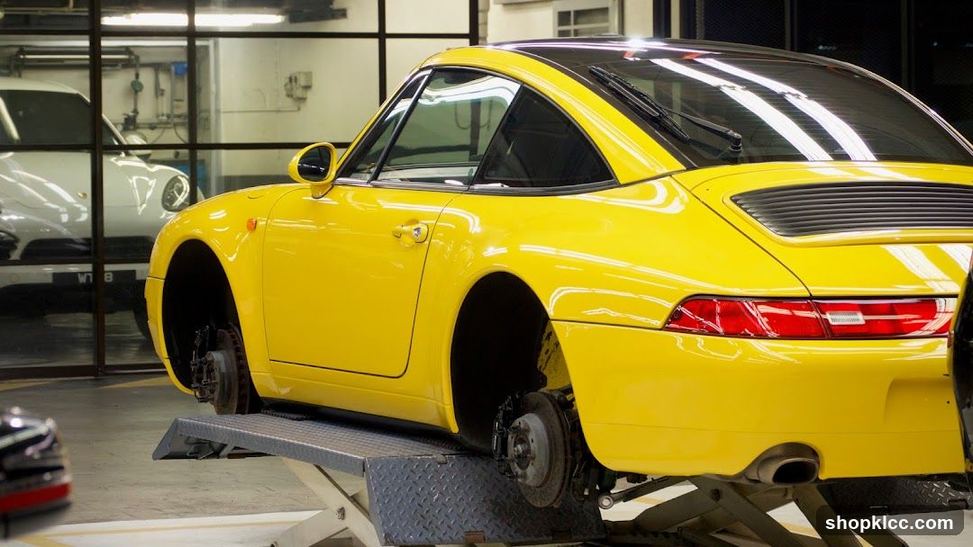 Yellow Porsche on Lift