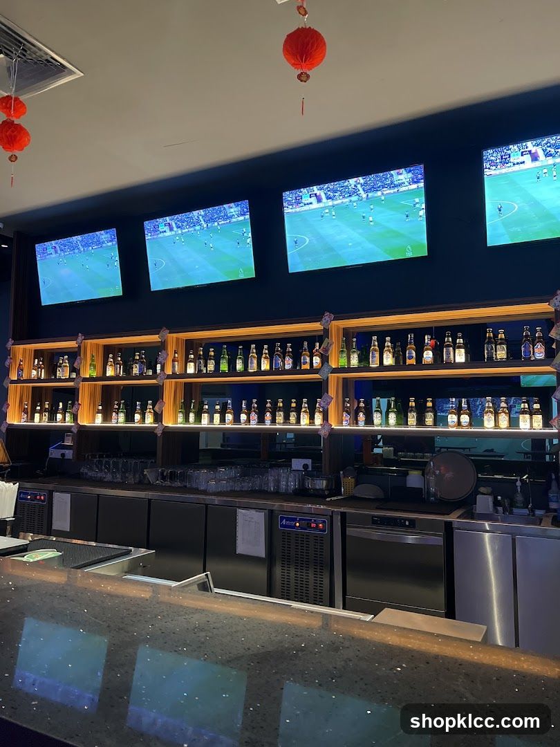 Bar with screens and bottles