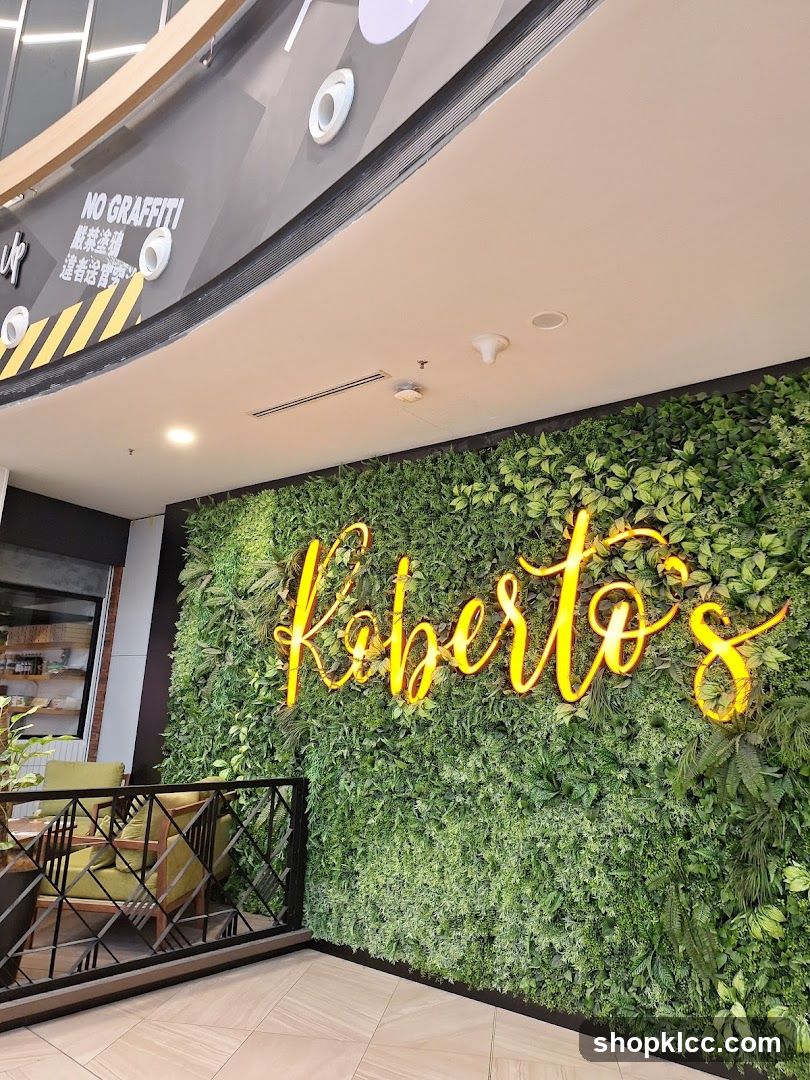 Roberto's Neon Sign on Green Wall