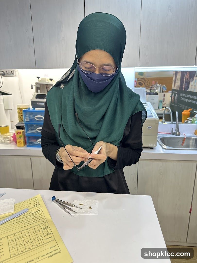 Optician adjusting eyeglasses