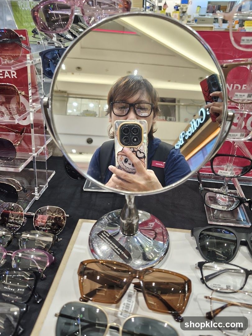 Woman trying on glasses