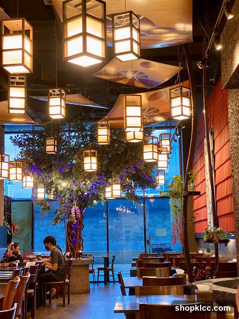 Restaurant Interior with Decorative Tree and Lanterns