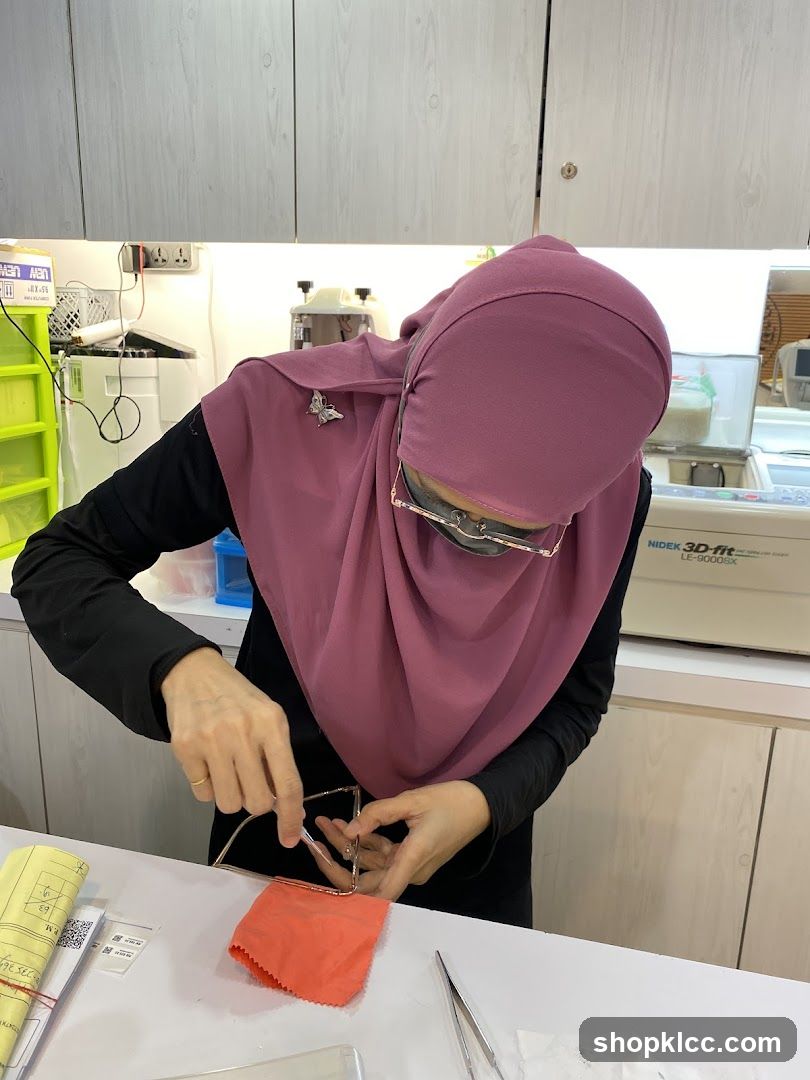 Optician adjusting eyeglasses