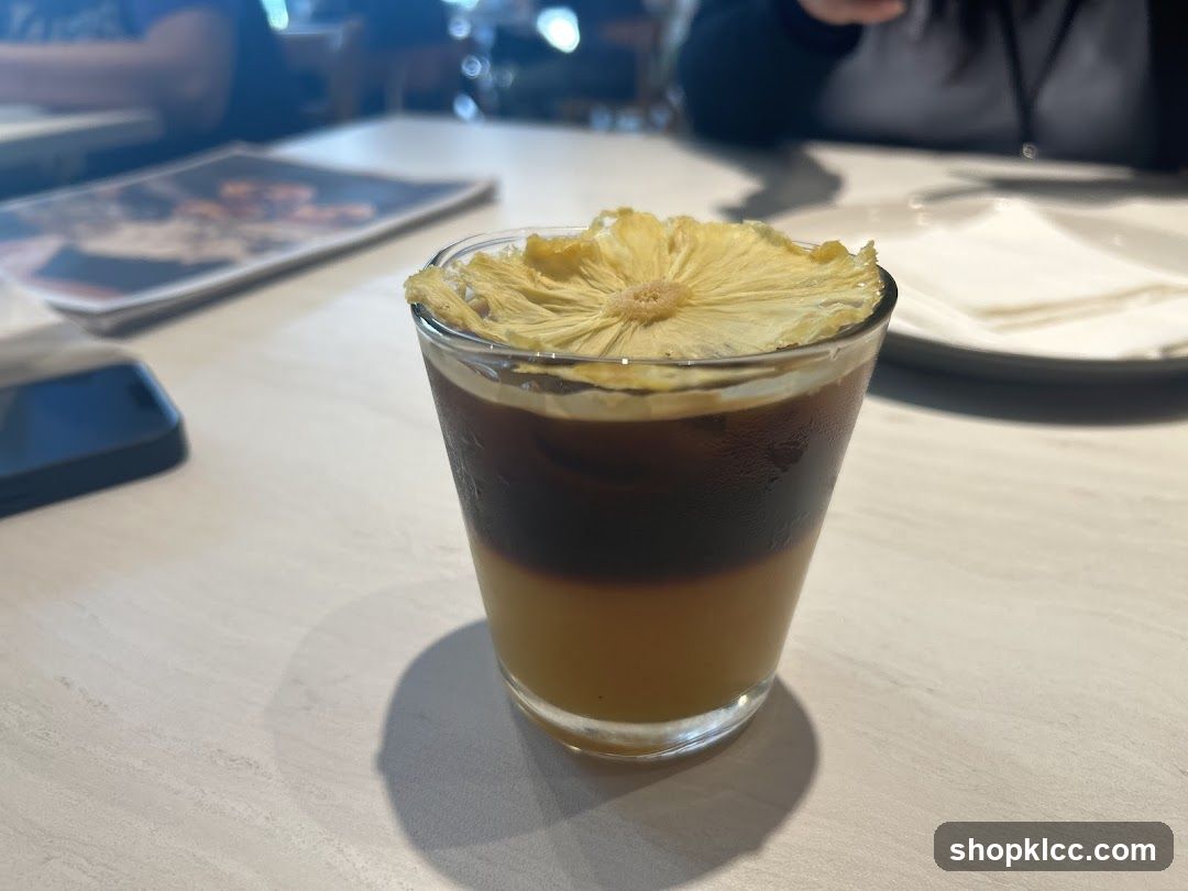 Layered Coffee Drink with Pineapple Garnish