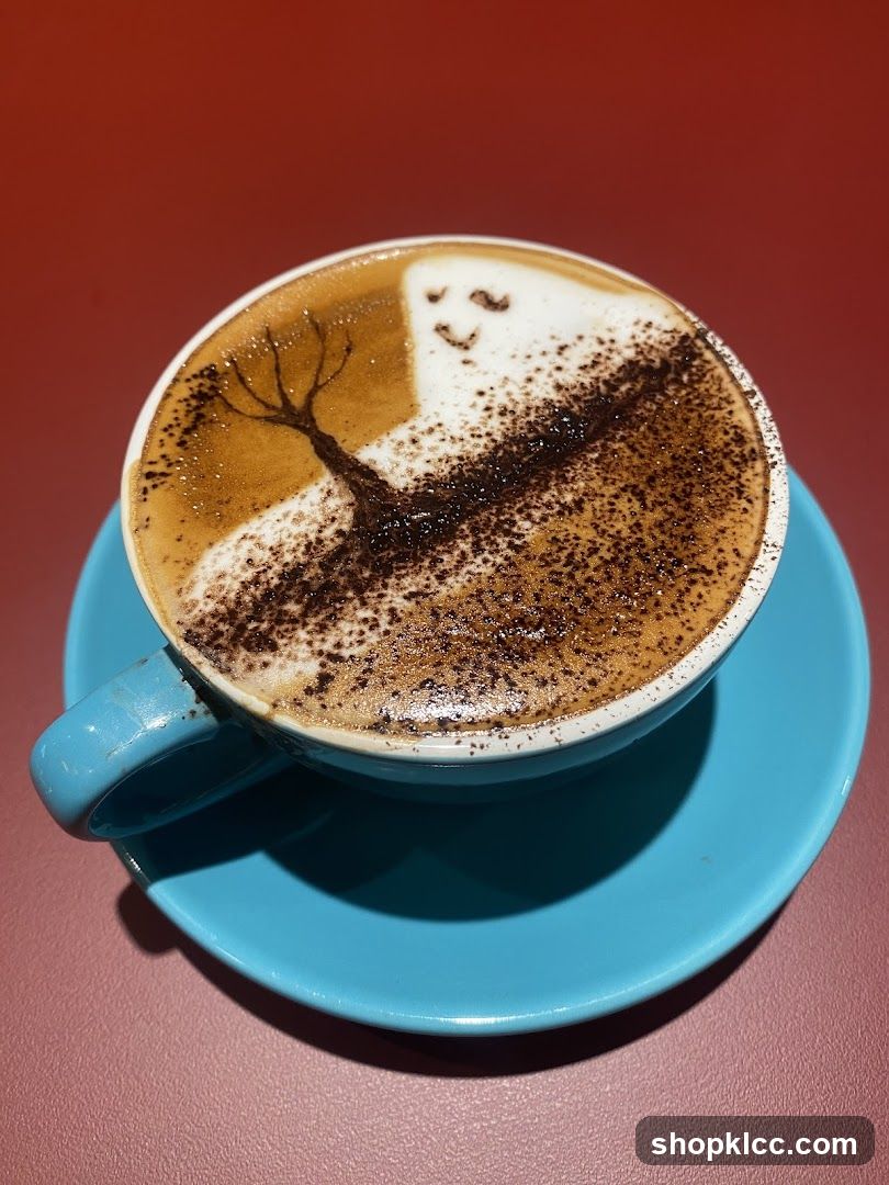 Latte art with a tree and a face
