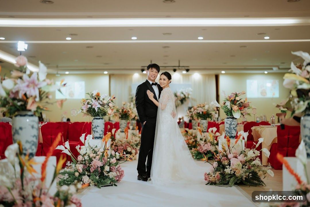 Wedding Couple Posing Amidst Floral Decorations