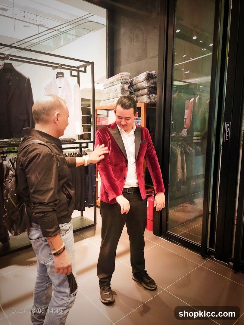 Man trying on a velvet jacket