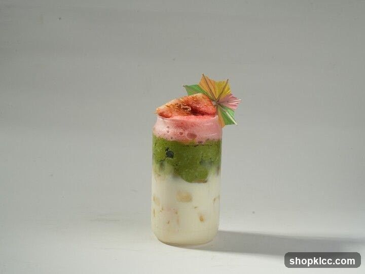 Layered Drink with Fruit and Umbrella