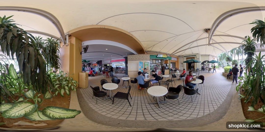 Outdoor seating area with shops