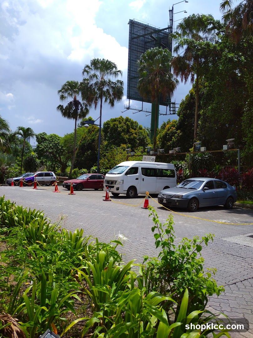 Parking Lot with Palm Trees and Billboard