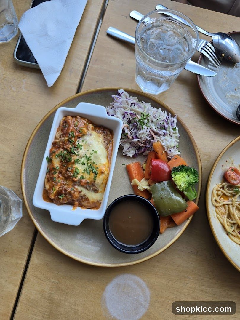 Lasagna with side salad and vegetables