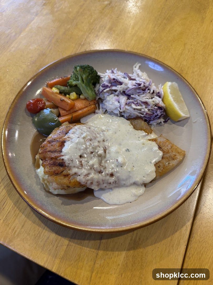 Fish dish with vegetables and coleslaw