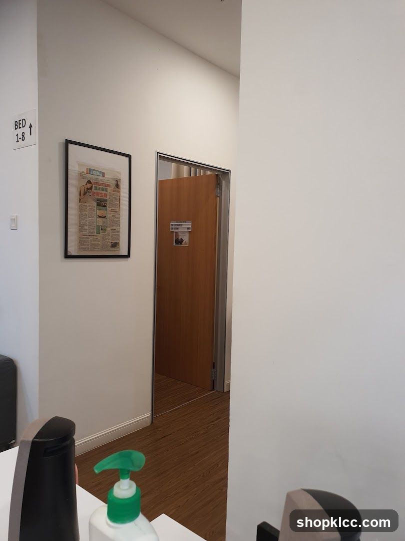 Hallway with framed newspaper and open door