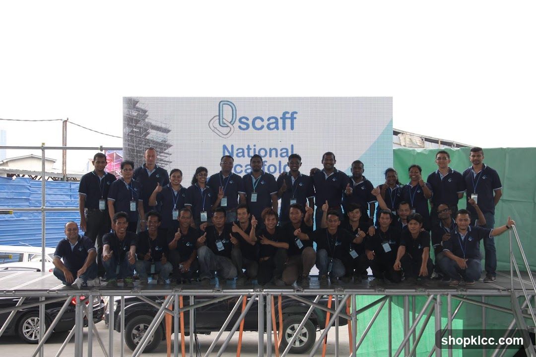 Group Photo with Scaffolding Company Logo