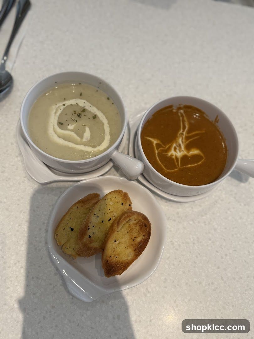 Two bowls of soup with garlic bread