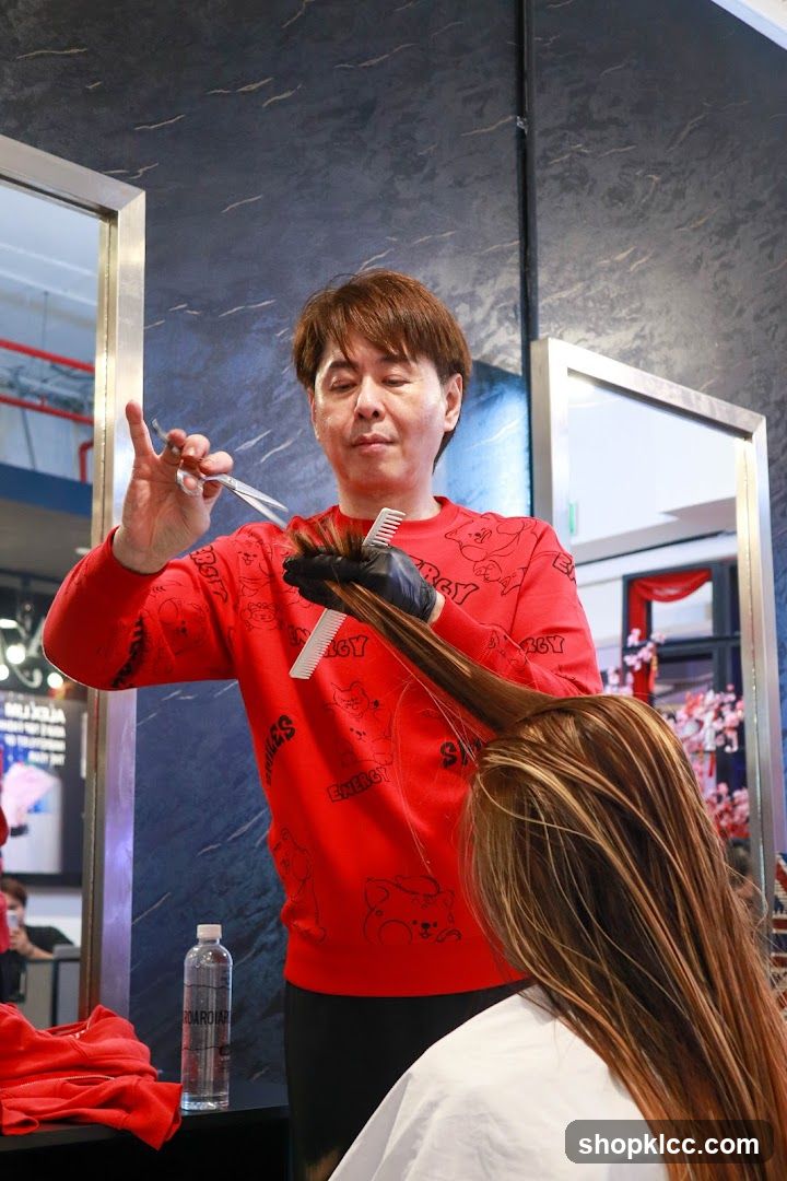 Hairdresser cutting hair