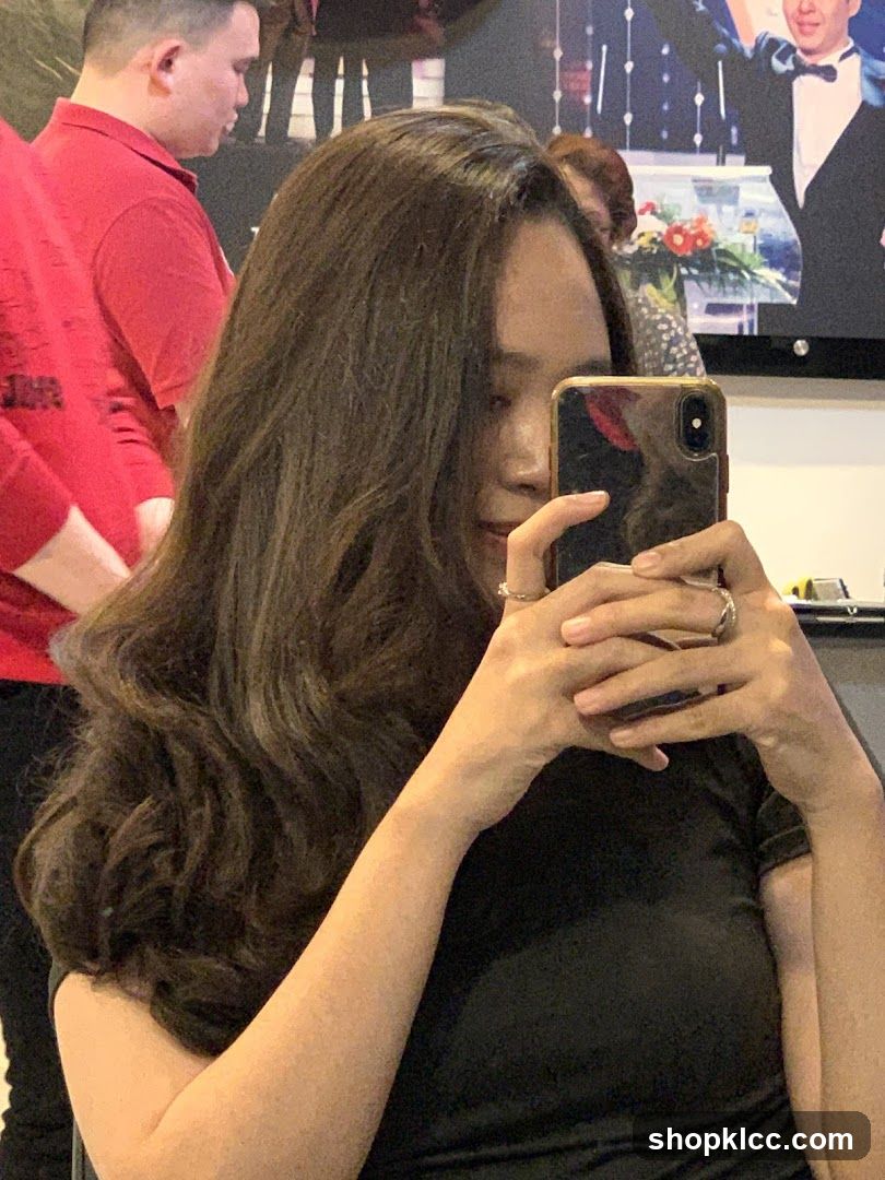 Woman taking a selfie in a salon