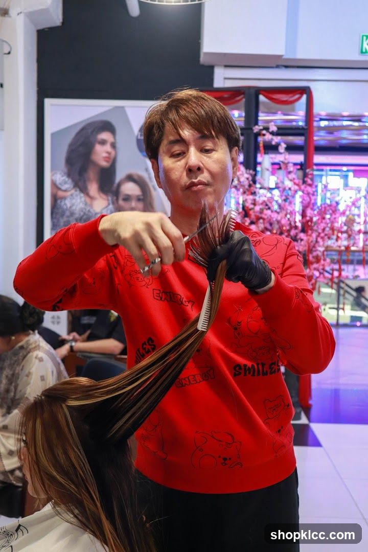 Hairdresser cutting client's hair