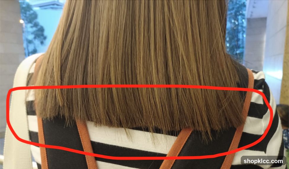 Back of a person with shoulder-length hair
