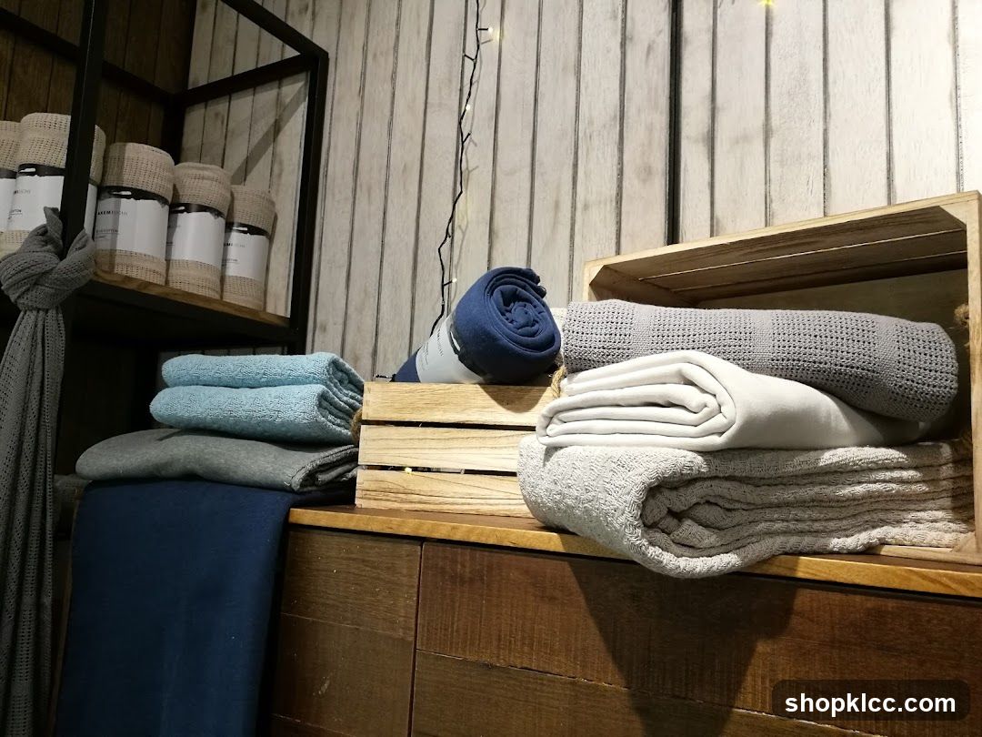 Folded blankets and throws on display