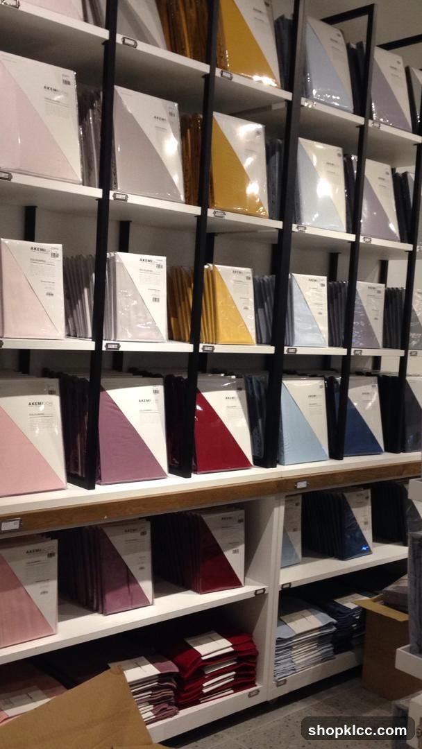 Shelves of folded bedding and linens