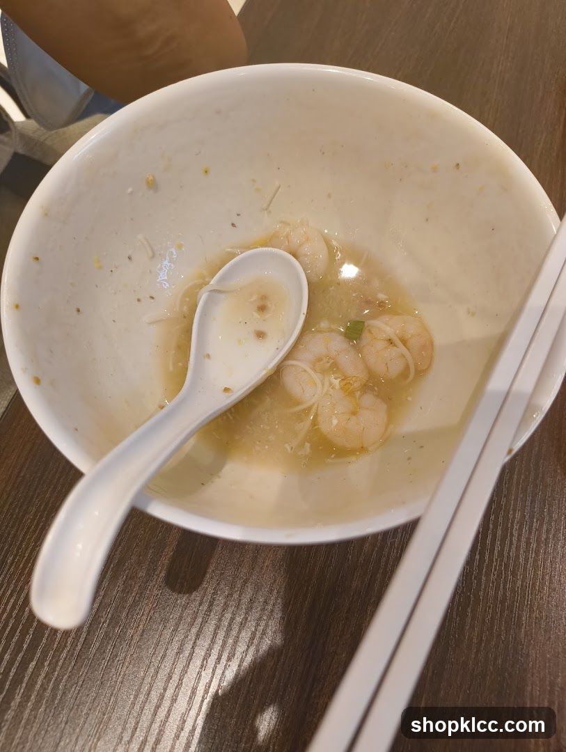 Partially Eaten Bowl of Noodles with Shrimp