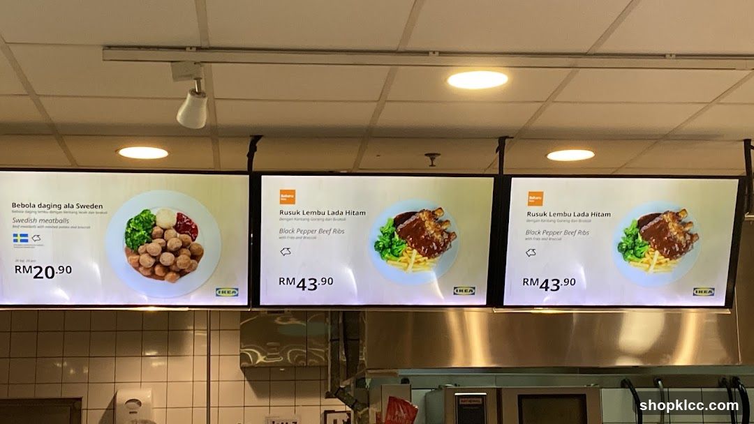 Digital menu boards displaying food items and prices.