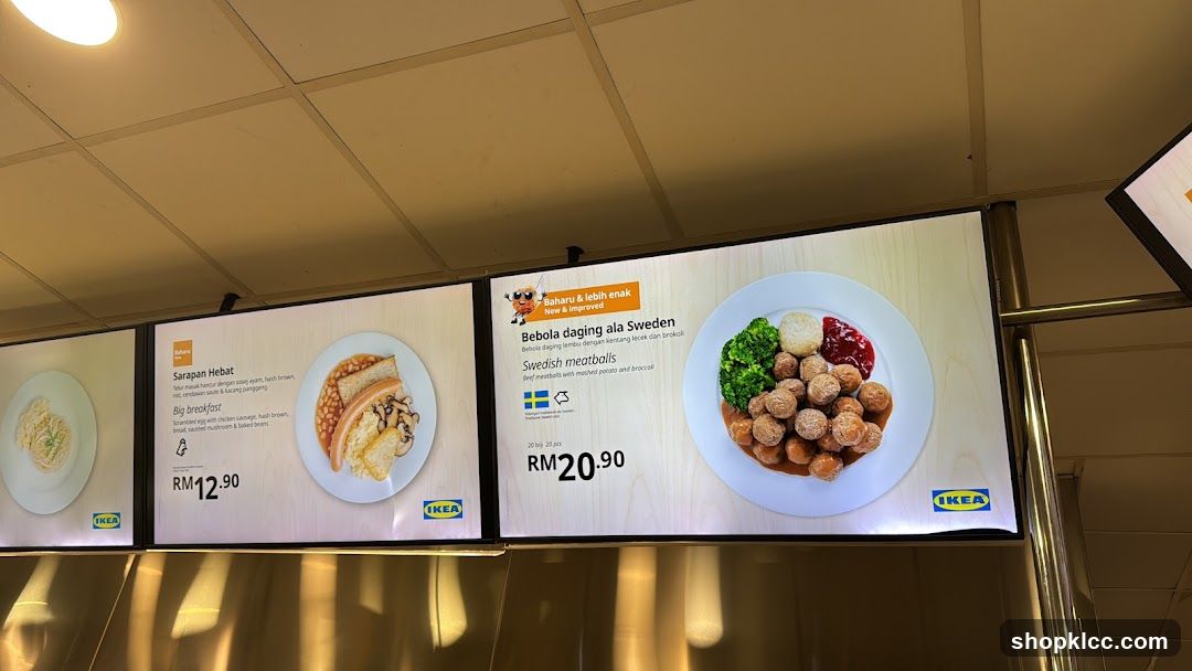 Digital menu boards displaying food items.