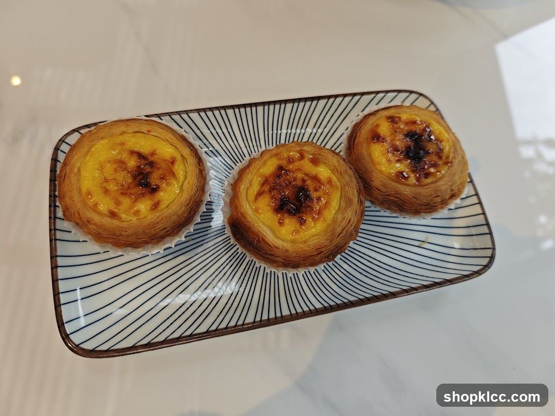 Three Egg Tarts on a Plate