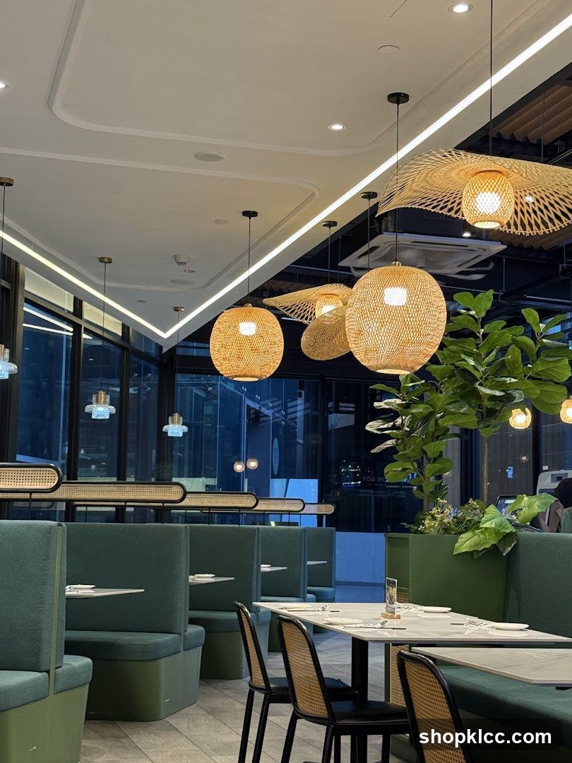 Restaurant Interior with Green Booths and Woven Lamps