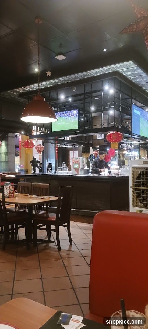 Restaurant Interior with Bar and TVs