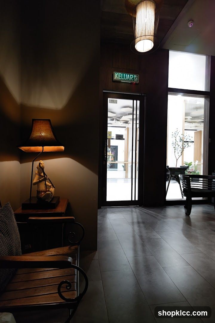 Interior hallway with seating and exit sign