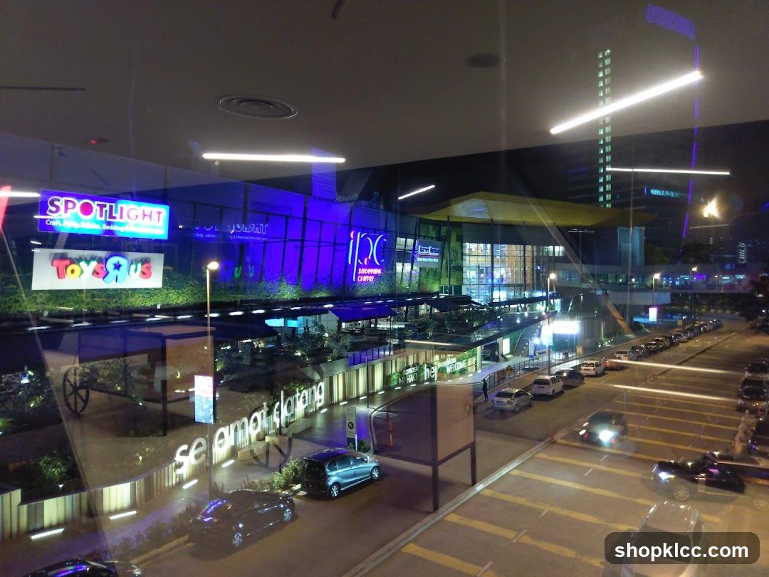 Night view of a shopping center with illuminated signs