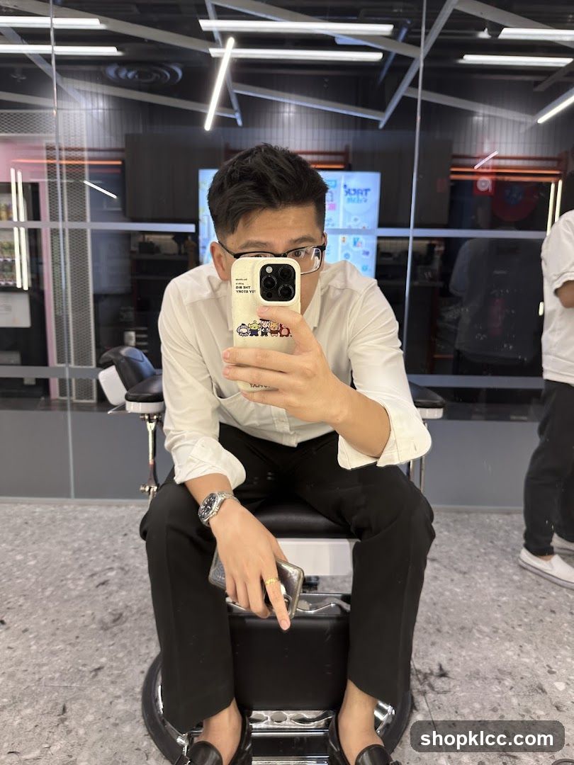 Man taking a selfie in a barber shop
