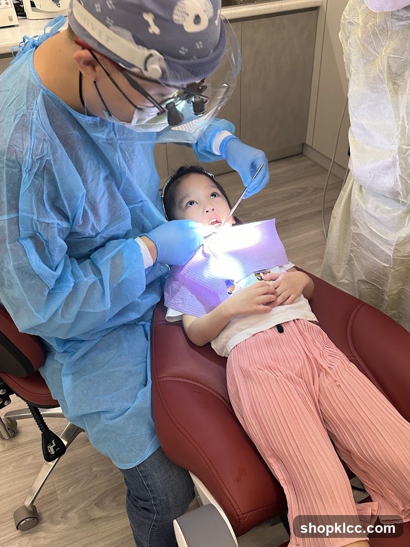 Dentist examining a child's teeth